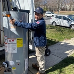 Unloading new water heater from the truck