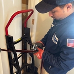 Taking the old water heater out of the home