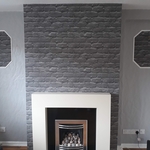 Completed job with wallpaper that looks like brickwork fantastic project customer absolutely blown away.