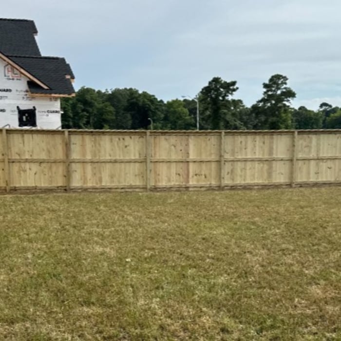back run of fence pictured from the back yard near the house
