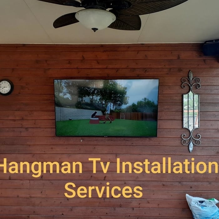Mountain TV on brick wall
