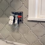 Tiles in place and ready for grout. Adjustable fixtures were put in to maintain proper spacing with the new thicker backsplash