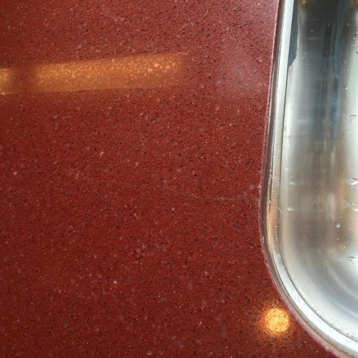 After: Red Quartz Countertop Crack Repaired
