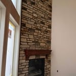 Stone veneer fireplace