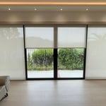 Motorized roller shades