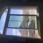 Custom Arch window installation mulled with double slider. Trimmed with white pine.