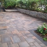 This project showcases a custom paver patio and steps designed. The patio features multi‑tone concrete pavers arranged in a modern pattern that complements the home’s exterior. Steps that create a durable, low‑maintenance outdoor space perfect for gatherings or relaxation. The combination of rich earth tones and precise craftsmanship highlights Kairos’s commitment to quality.