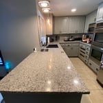 New light fixtures glowing over custom countertops