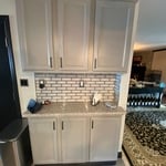 In this section we removed a built in oak desk and replaced it with matching cabinets, countertop, and backsplash