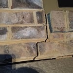 Brick unsupported between windows fell
