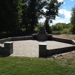 Outdoor fire place, patio, bench walls & columns.