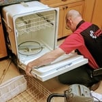 Technician Jayson repairing a dishwasher