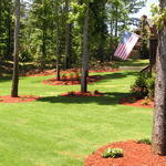 Irrigation System New Sod Plants and Red Mulch