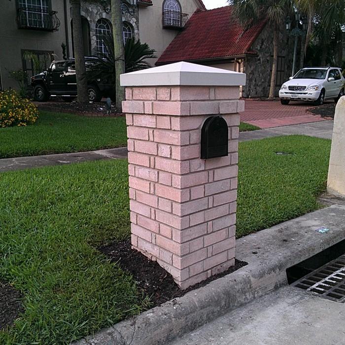 Brick mail box with cast stone cap