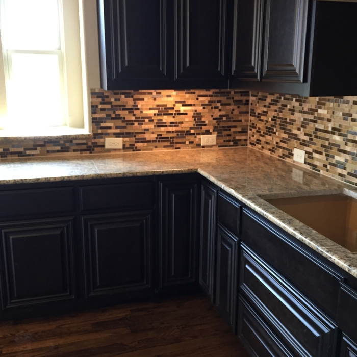 DARK KITCHEN CABINETS WITH A LIGHTER GRANITE