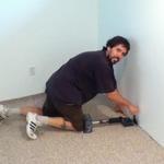 stretching and tucking the edge to the wall