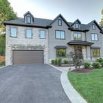 stone and stucco facade with metal accents