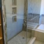 sleek walk in shower with swinging glass door