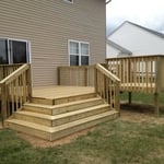 Treated wood deck with wrap around steps