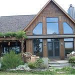 Traditional Home Exterior - Wood Brown Steeply Pitched Roof Line