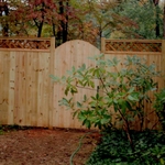 Vertical board fencing with lattice