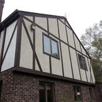 Stucco with Tudor style wood trim