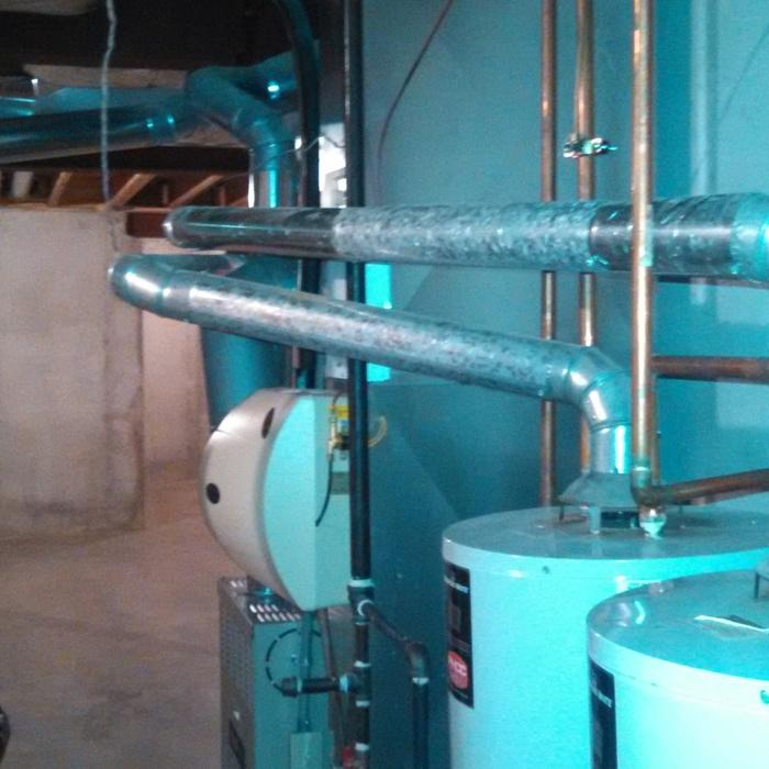 Before dual water heater vent upgrade