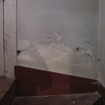 damaged stairway wall