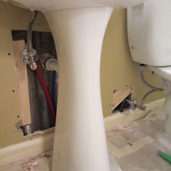 plumbing holes in drywall under sink