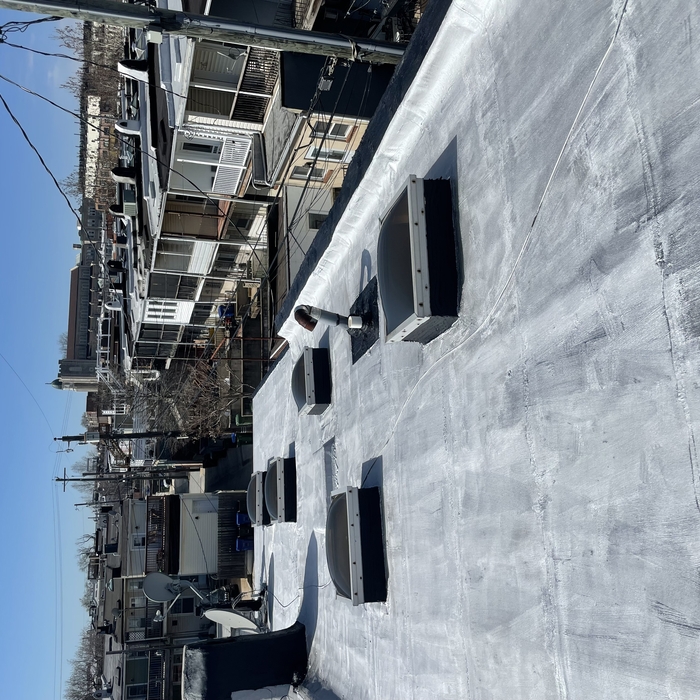 Flat rubber roof after service/aluminum sealant