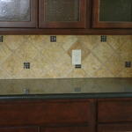 Kitchen backsplash with glass inserts