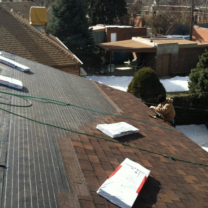 View of the back side of the house. Shingles bein