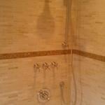 small stone tile shower surround
