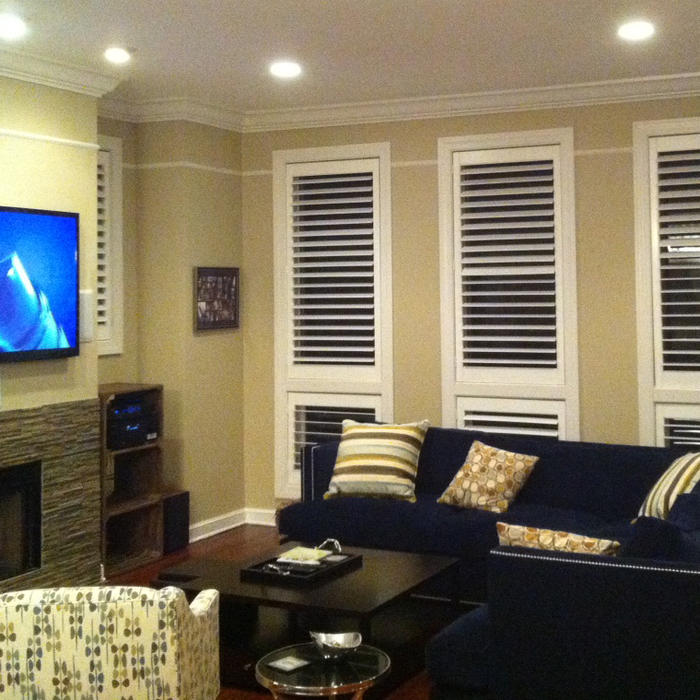 Plasma TV above fireplace w/surround sound system