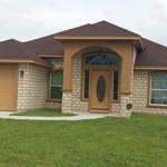 Small home exterior with one car garage