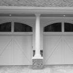 Carriage House with Sculpted Window Over Door