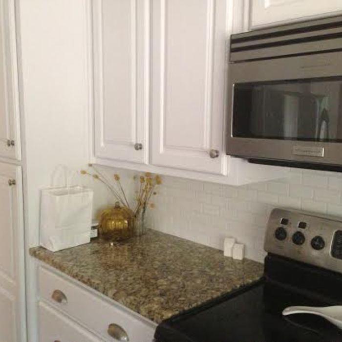 White satin finish with subway tile backsplash