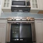 Transitional Kitchen - Blue Tile Stainless Steel Appliances