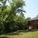Large Tree in danger of falling on house