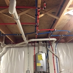 Tankless water heater with piping