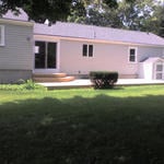 Rear of home with new slider and deck