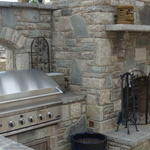 Traditional Outdoor Kitchen - Grey Iron Stone Archway Over Grill