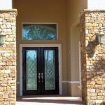 Traditional Patio - Tan Black French Doors With Elegant Detailed Glass Panels