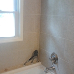 jaccuzi tub and ceramic tile with custom sprayer