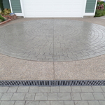 Circular stamped driveway with drain