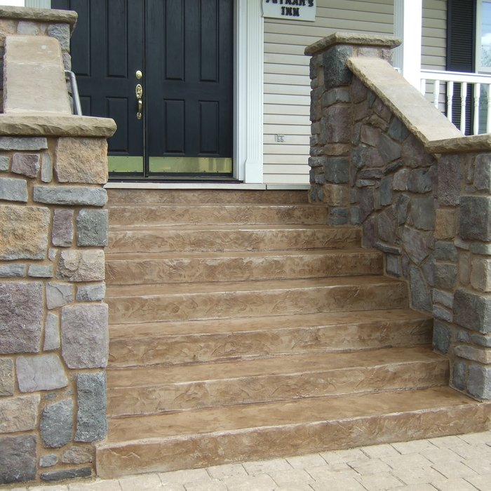 Cultured stone front entry with stamped steps