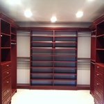 Walk in closet in a cherry finish