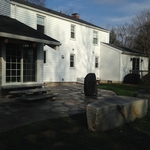 a flagstone patio with slate slab steps and large flat top rocks for benches makes for an inviting outside spot