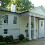 Traditional Home Exterior - Green White White Framed Windows And Doors