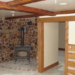 fireplace room with beams